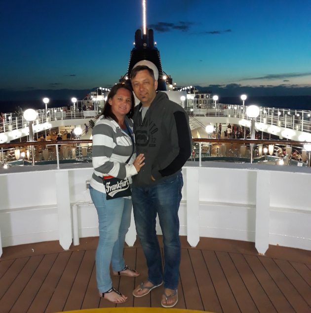 Photo just after sunset of a couple on the top deck of the MSC Musica