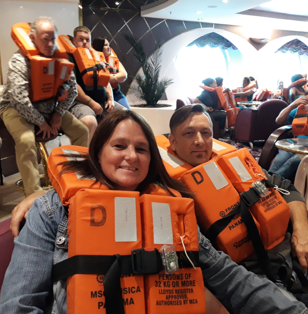 A couple in lifejackets on the MSC Musica